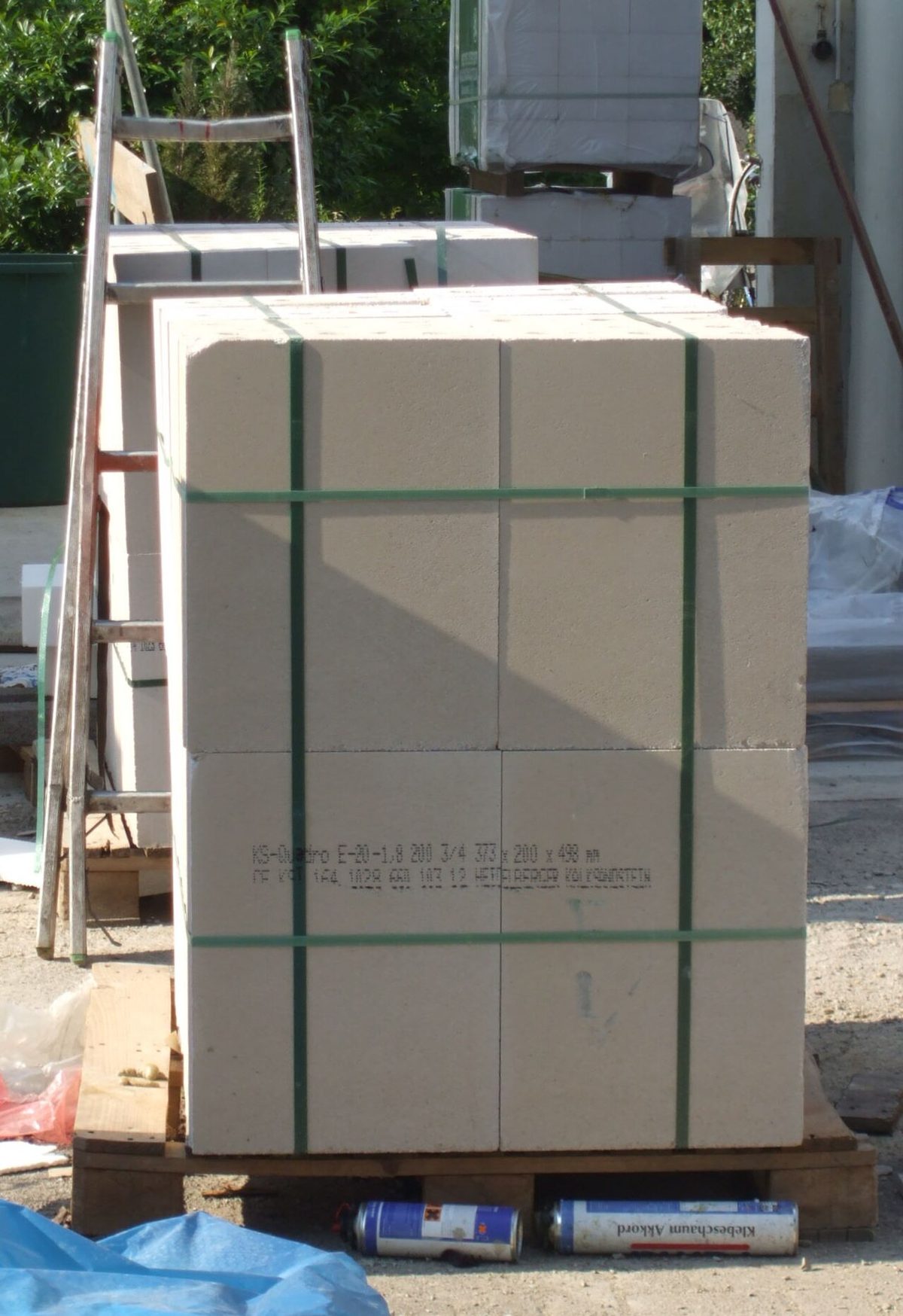 Palletised goods secured with green polyester strapping